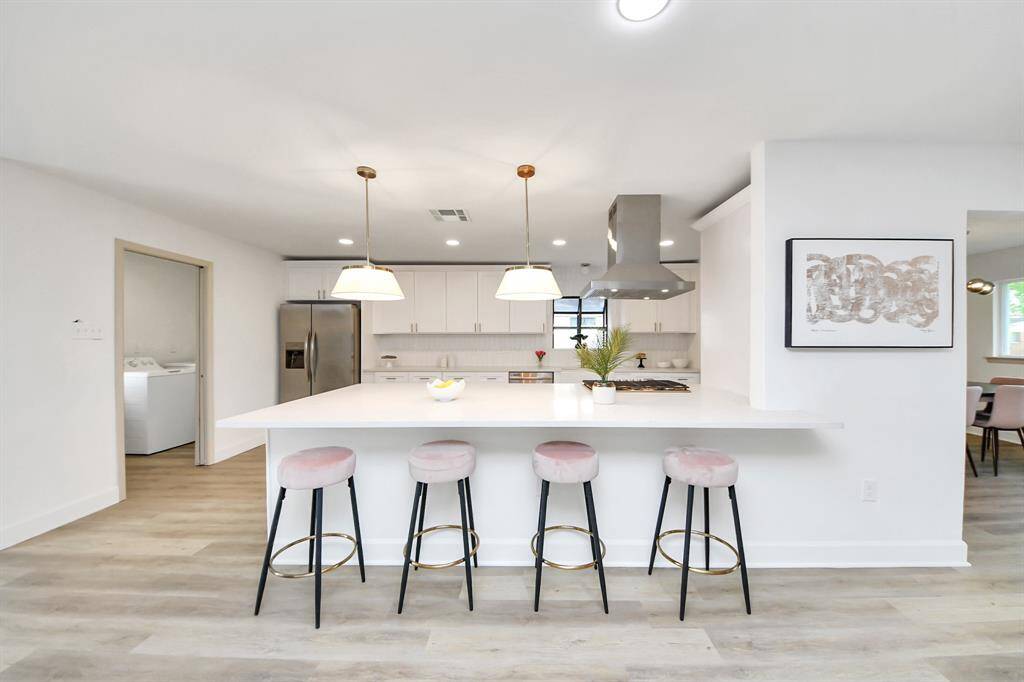 Huge kitchen island with quartz countertop