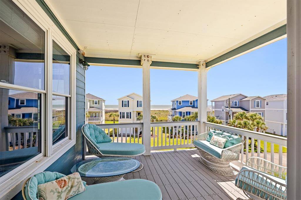 2nd floor balcony accessible from the living area has Beach/Sunrise views and Bay/Sunset views