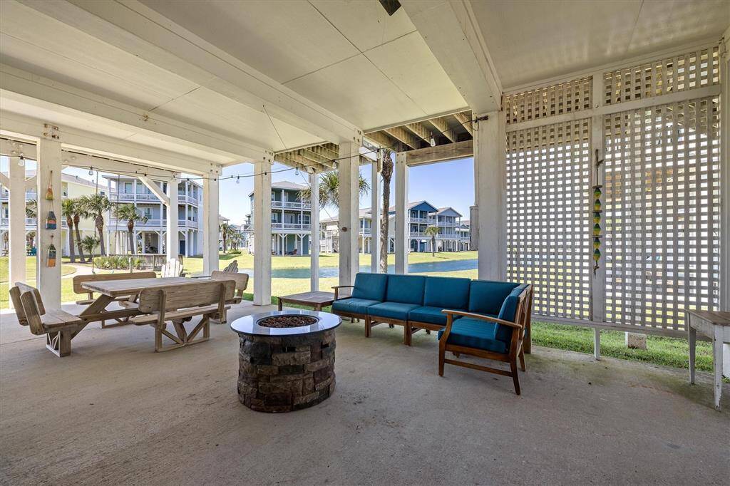 Spacious Outdoor Living Area has a mounted outdoor TV with special weather resistant cover (not shown here), an outdoor shower, and a storage closet on the back of the garage for beach toys, kayaks, surf boards, etc...