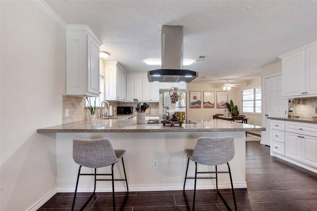 Breakfast Bar over looking the Kitchen and Dining Room.