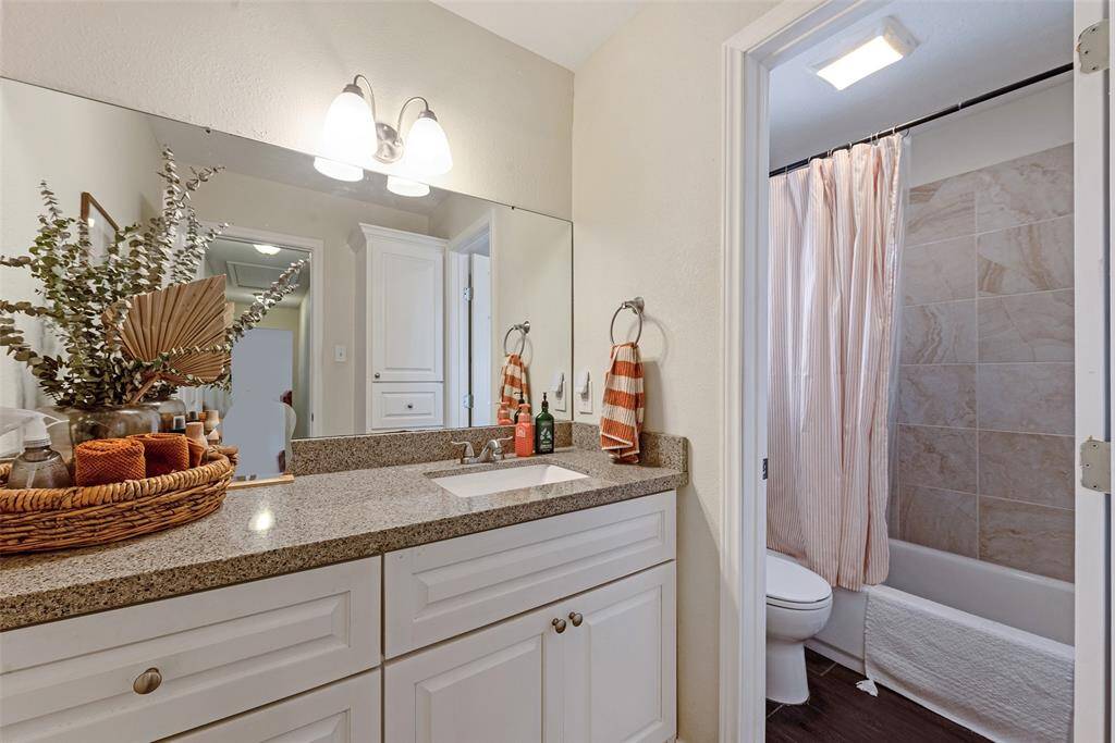 Updated Secondary Bathroom with ample vanity and  undermount sink.