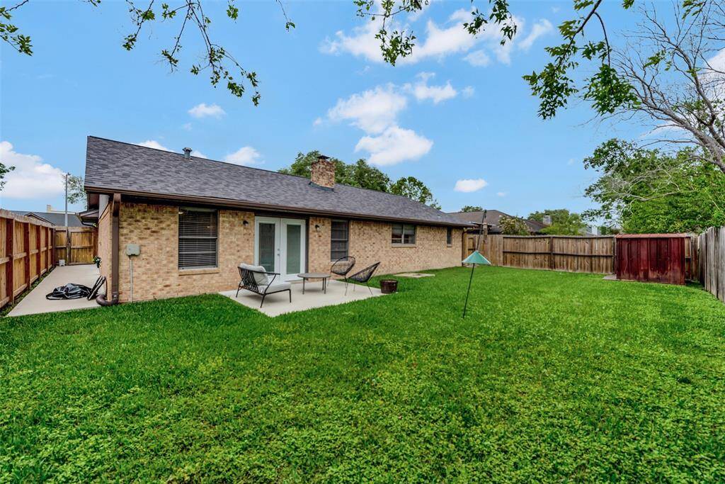 Spacious backyard with recent Concrete Patio