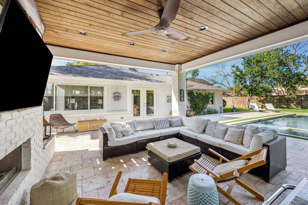 Beautiful stone flooring on patio and pool surround.