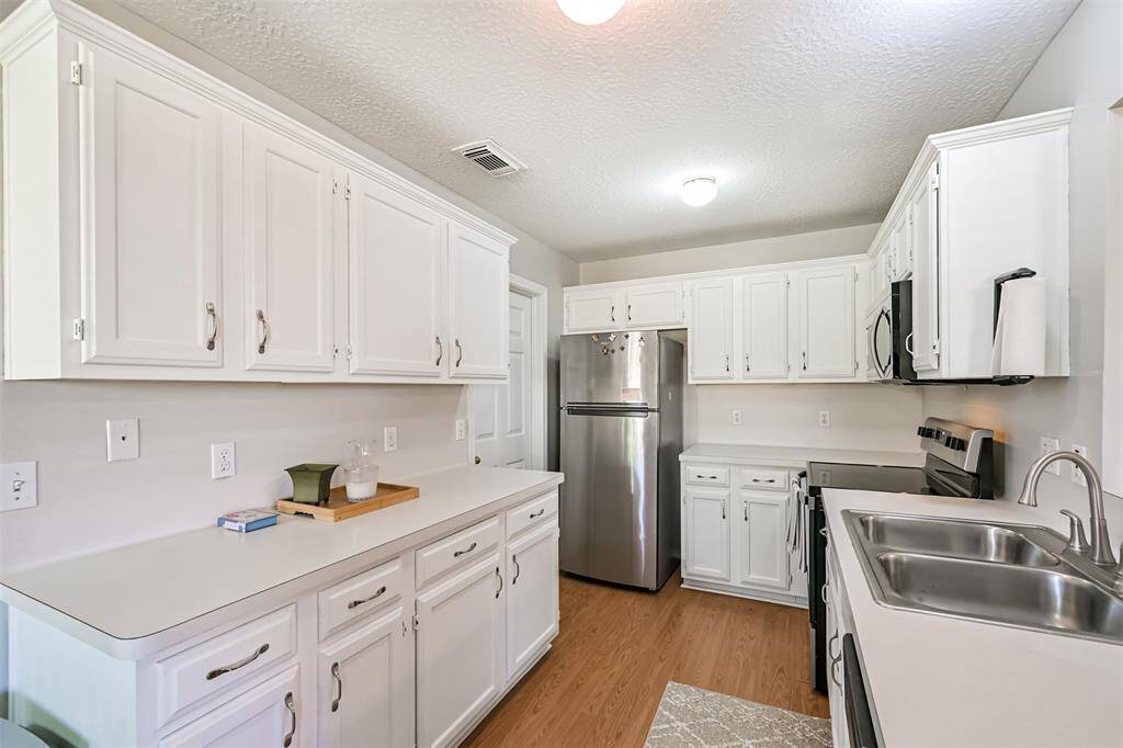 Kitchen including refrigerator