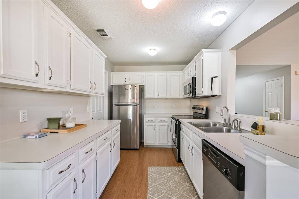 Kitchen including refrigerator