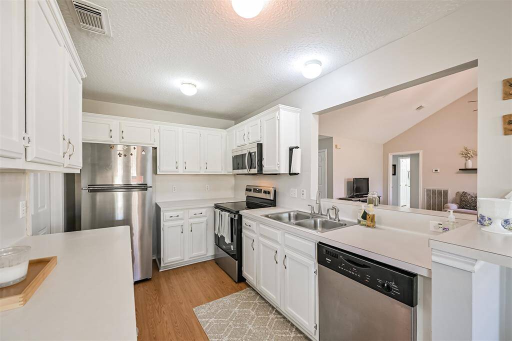 Kitchen including refrigerator