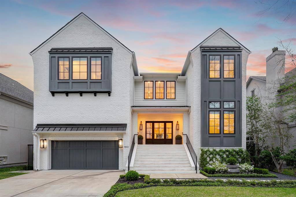Impressive curb appeal meets modern elegance in this show-stopping façade. Painted queen brick pairs effortlessly with striking charcoal accents and black metal roofing, creating a bold yet timeless aesthetic. A wide front staircase leads to a welcoming covered entryway, framed by two 36-inch gas copper lanterns and crowned with a substantial custom metal-and-glass entry door (measuring 9 feet wide, 8 feet tall, with a 4-foot opening).