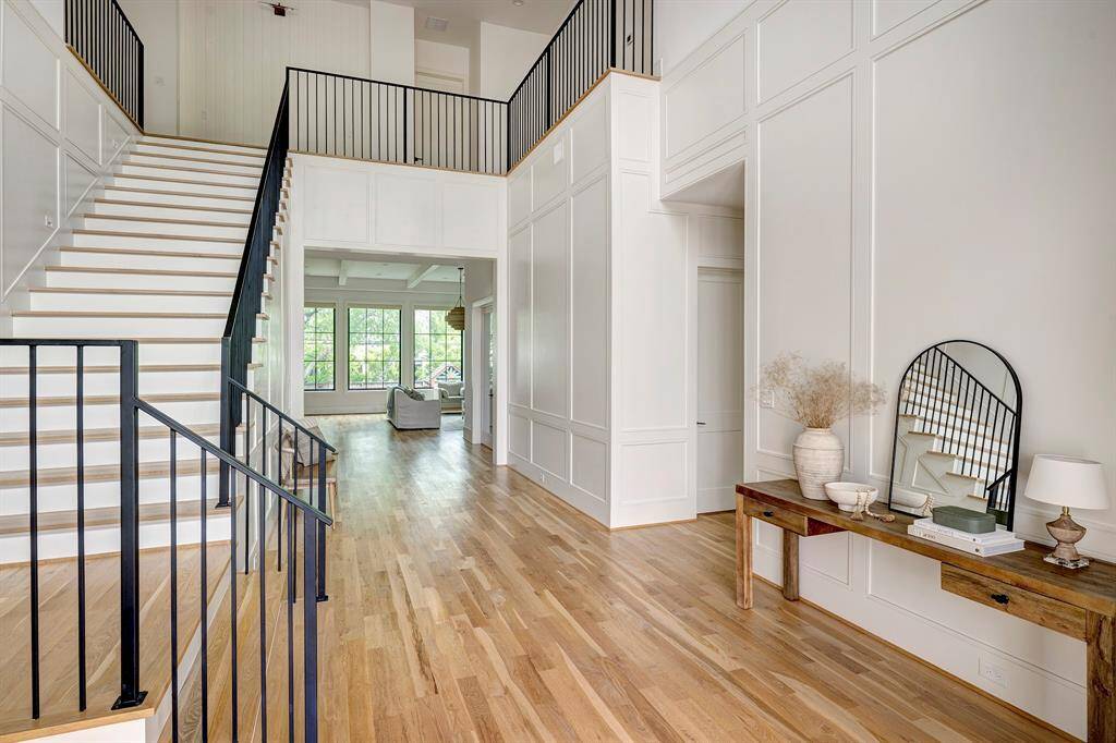 Upstairs, you'll find a fabulous primary suite featuring a luxurious spa-like bath and dual walk-in closets. Four additional secondary bedrooms each offer private en-suite baths, ensuring comfort and privacy for all. A spacious game room provides a perfect spot for relaxing or entertaining, while the well-appointed upstairs laundry room adds everyday convenience.