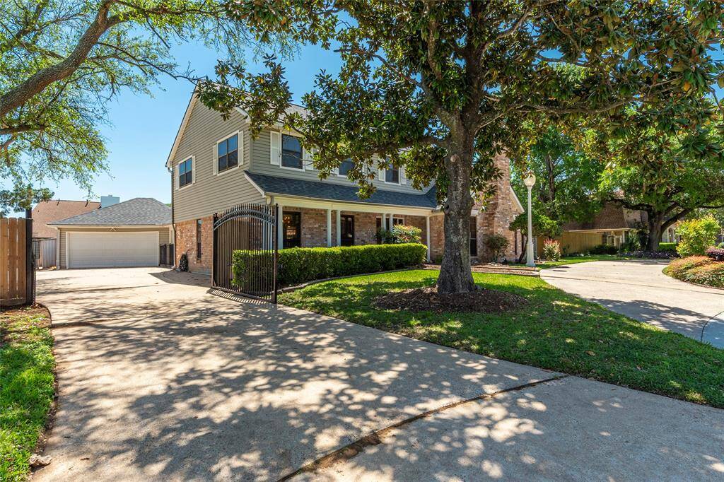 Long driveway with detached garage