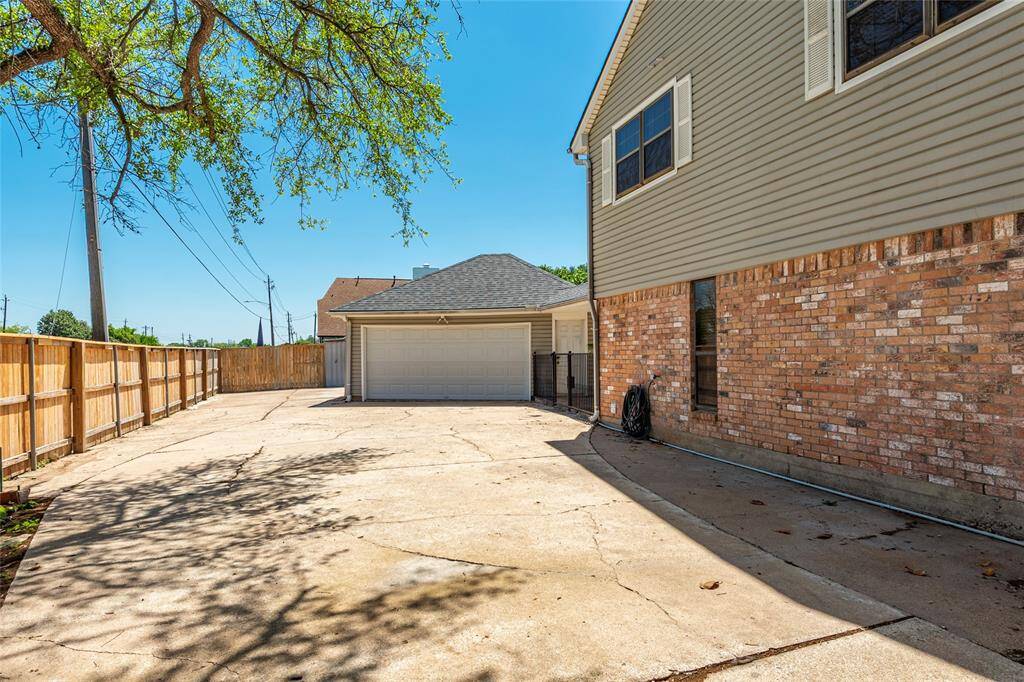 Extra wide driveway and detached garage