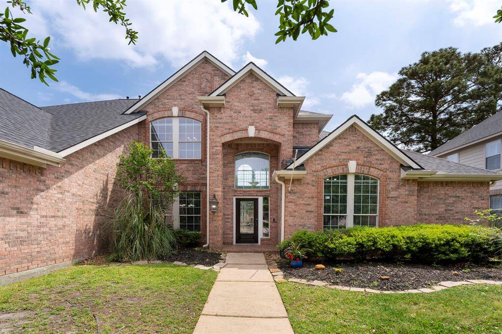 Low maintenance landscaping welcomes friends and family home.
