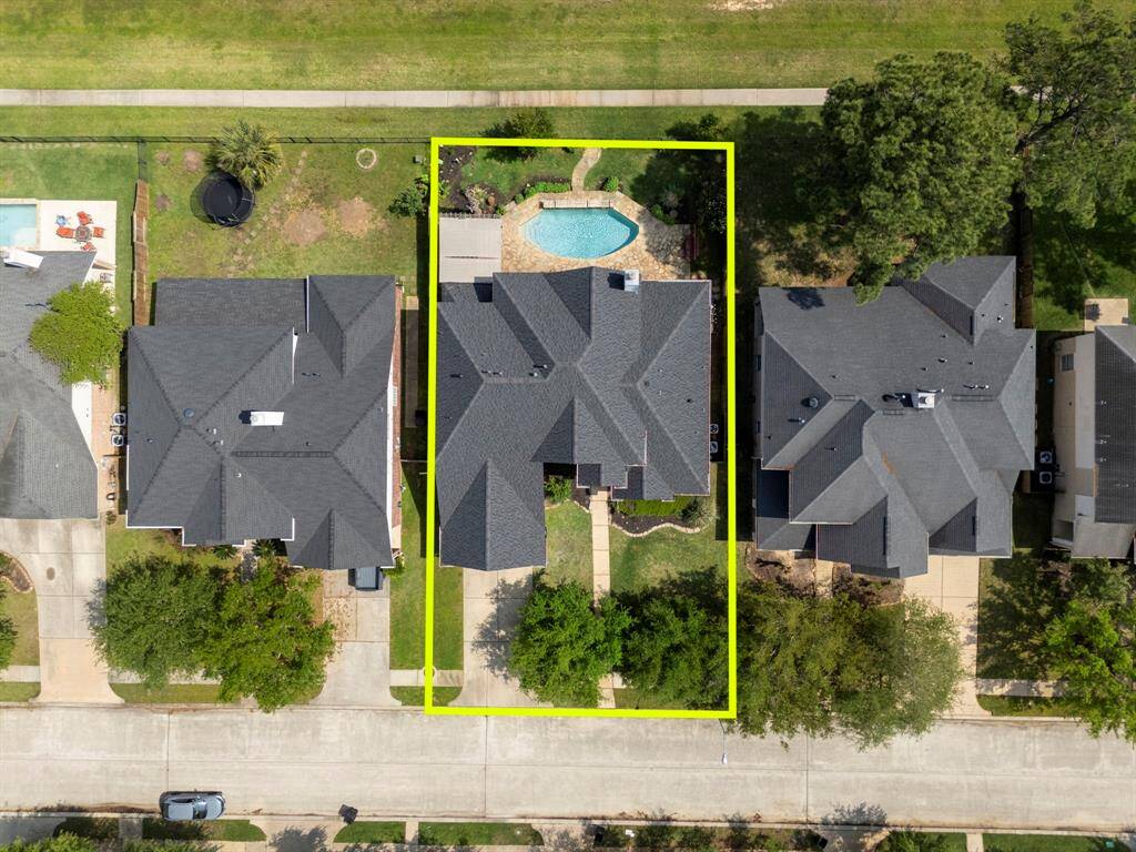 Custom lake lot with pool and direct lake access.