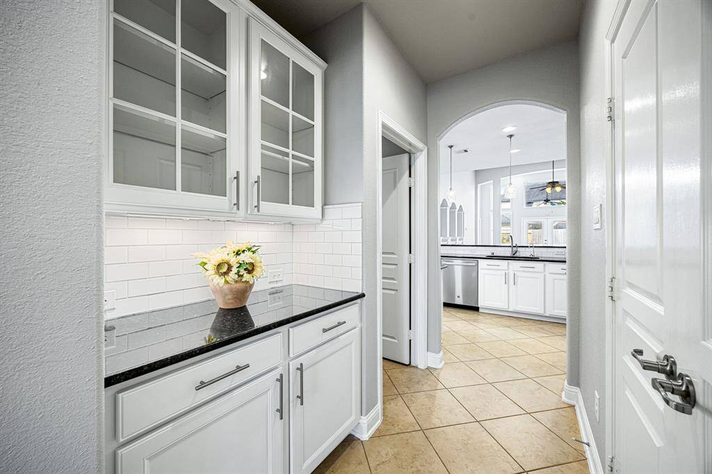 Butlers pantry connects the kitchen and dining.