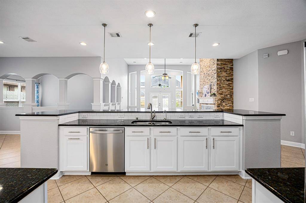 The kitchen puts you in the heart of the home with great sight lines to the living room, flex room and study. The family room has windows overlooking the patio and pool areas