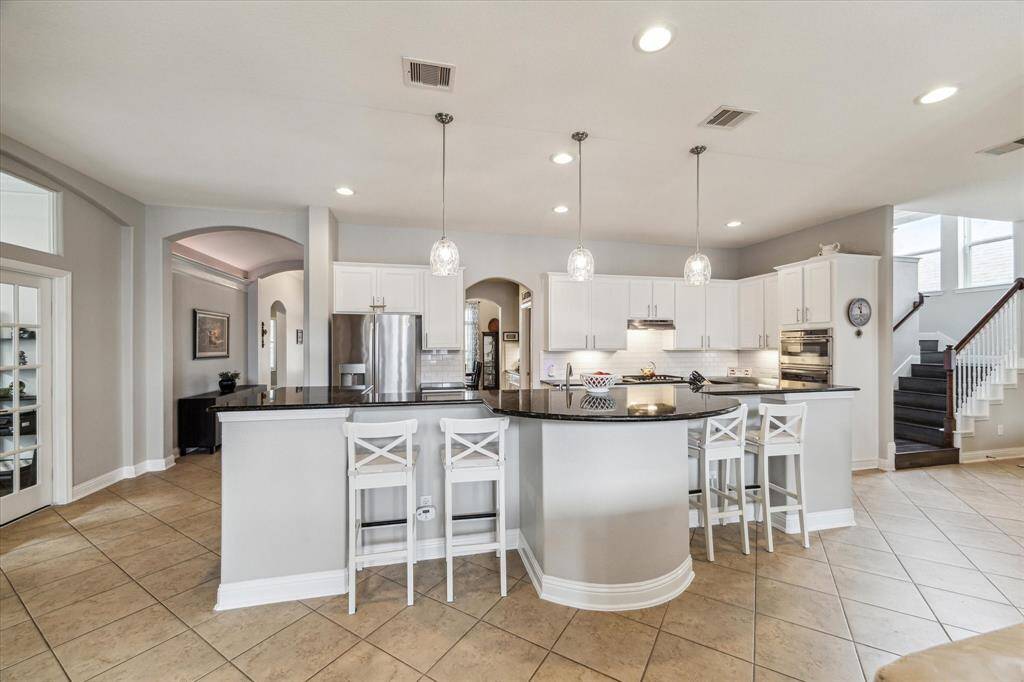 This home offers a great floorplan with a versatile study, upstairs game room, fabulous closet space...it's all here! Any chef's dream, this stunning kitchen is perfect for everyday life as well as entertaining family and friends! Extra large kitchen island is perfect for conversation or that much needed space to lay out your party spread for everyone to enjoy!