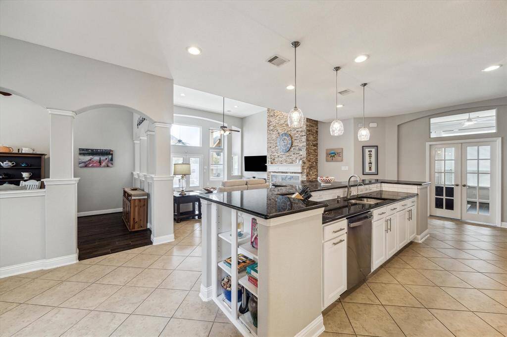 The kitchen is perfect if you love to cook! Granite counter tops, gas cook top, under cabinet lighting and more!...Butlers pantry between the kitchen and dining room. Featuring granite counter tops and glass inserts in upper cabinets.