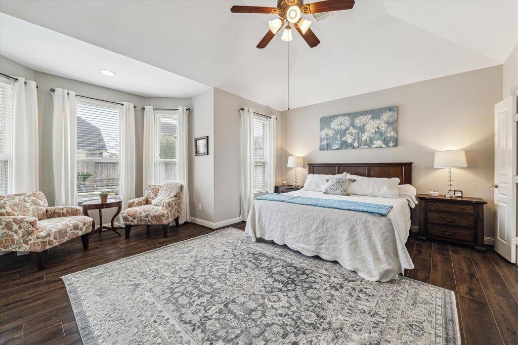 The breakfast area off the kitchen has great lighting with an access door to the side yard. The breakfast room offers a cheery spot for informal dining.