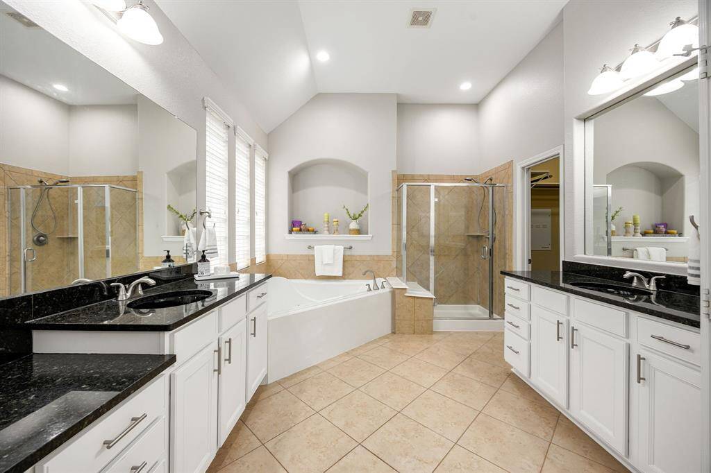 The bay window located in the primary suite overlooks the backyard and pool.