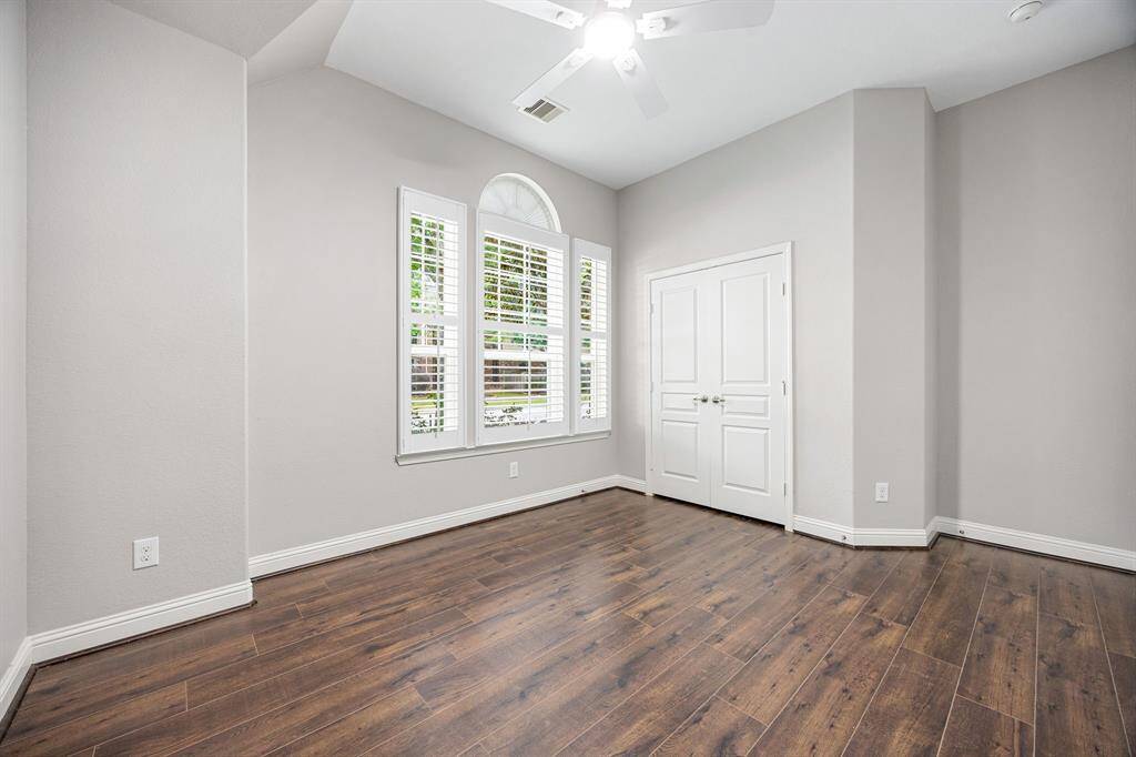 One of three secondary bedrooms. This one includes an en-suite bath that is perfect for guests!