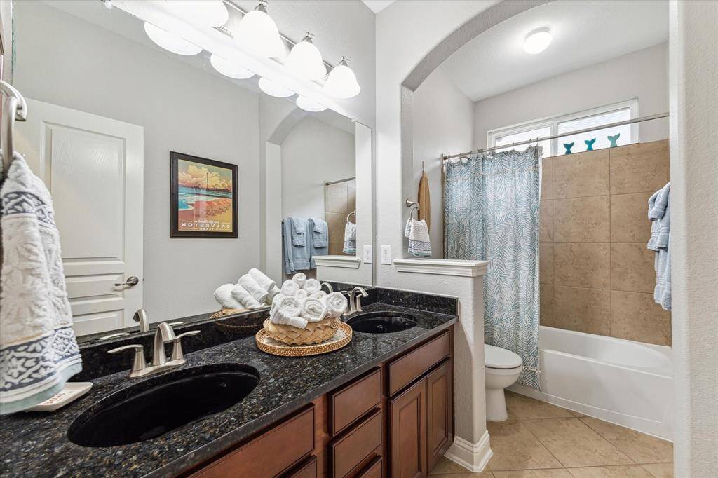 Front secondary bedroom with shared bathroom, split floorplan with bedrooms at the front and back of the home.