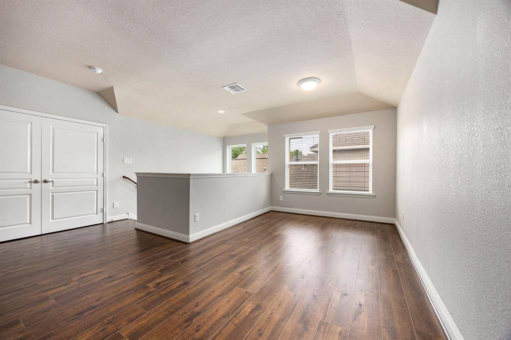 The game room opens from the upstairs stair landing. It offers plenty of room for pool table, large TV...you name it! It has a ceiling fan and a nice closet for tucking away your favorite games.