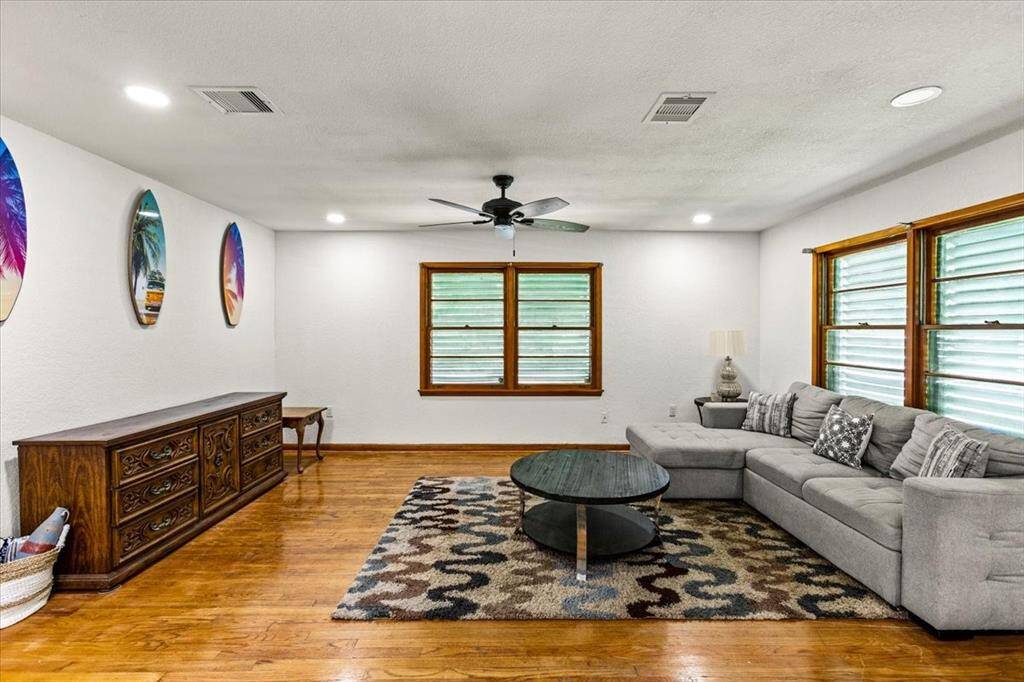 Home features ceiling fans and recessed lighting throughout, creating a cozy atmosphere.