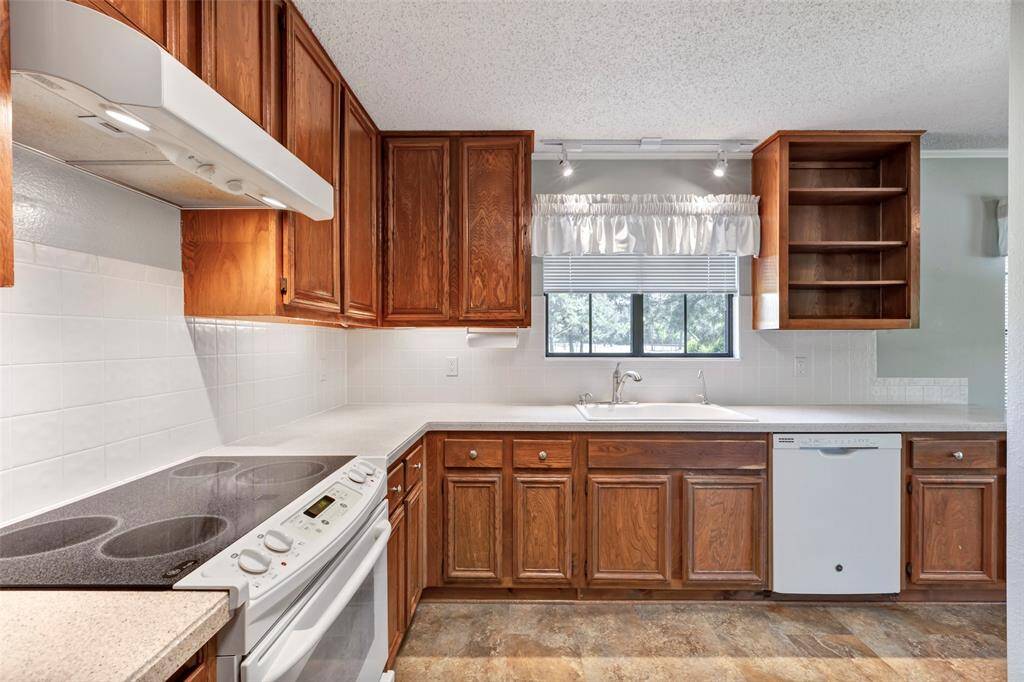 Another view of kitchen equipped with dishwasher.