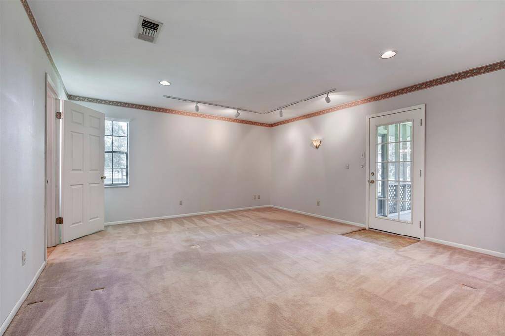 Primary Bedroom. Door to the right leads you to the enclosed sunroom.
