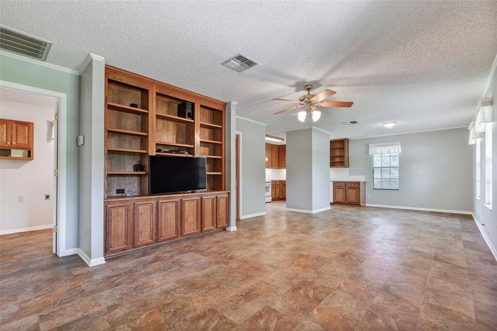 Living dining and kitchen have laminate flooring, great material for high traffic areas with minimal maintenance.