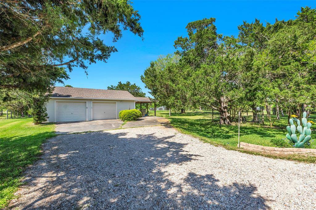 Detached oversized 2-car garage. Nice porch area attached to garage