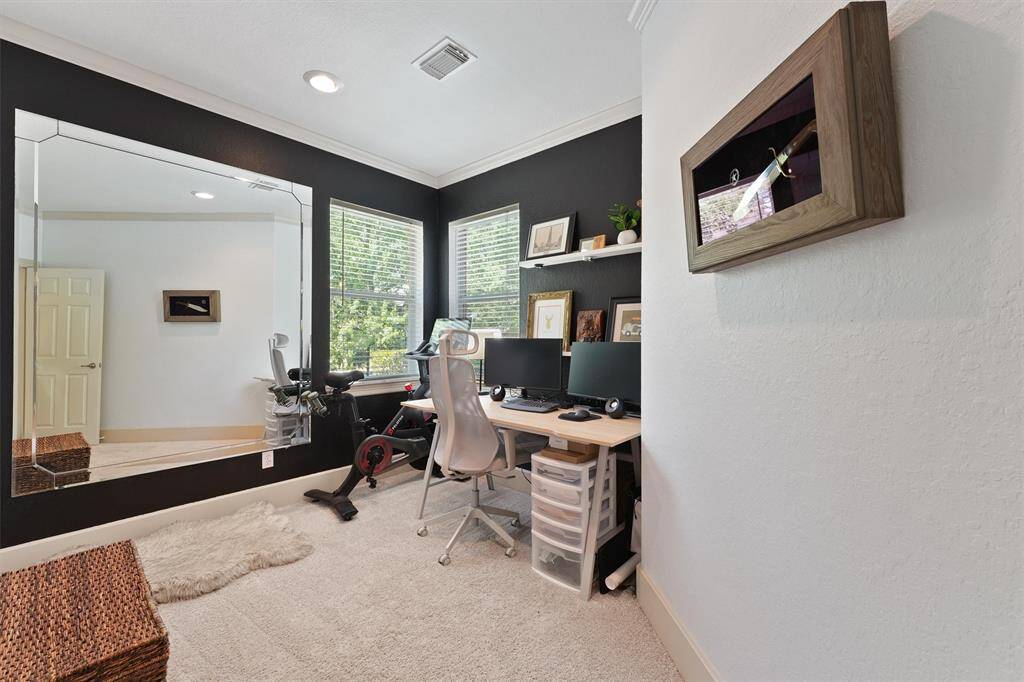 Spacious flexible space right off the primary suite perfect for an additional home office, nursery, or whatever your needs may be.