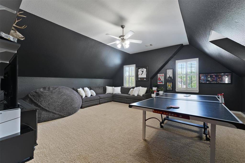 The upstairs game room is perfect flexible space for entertaining.