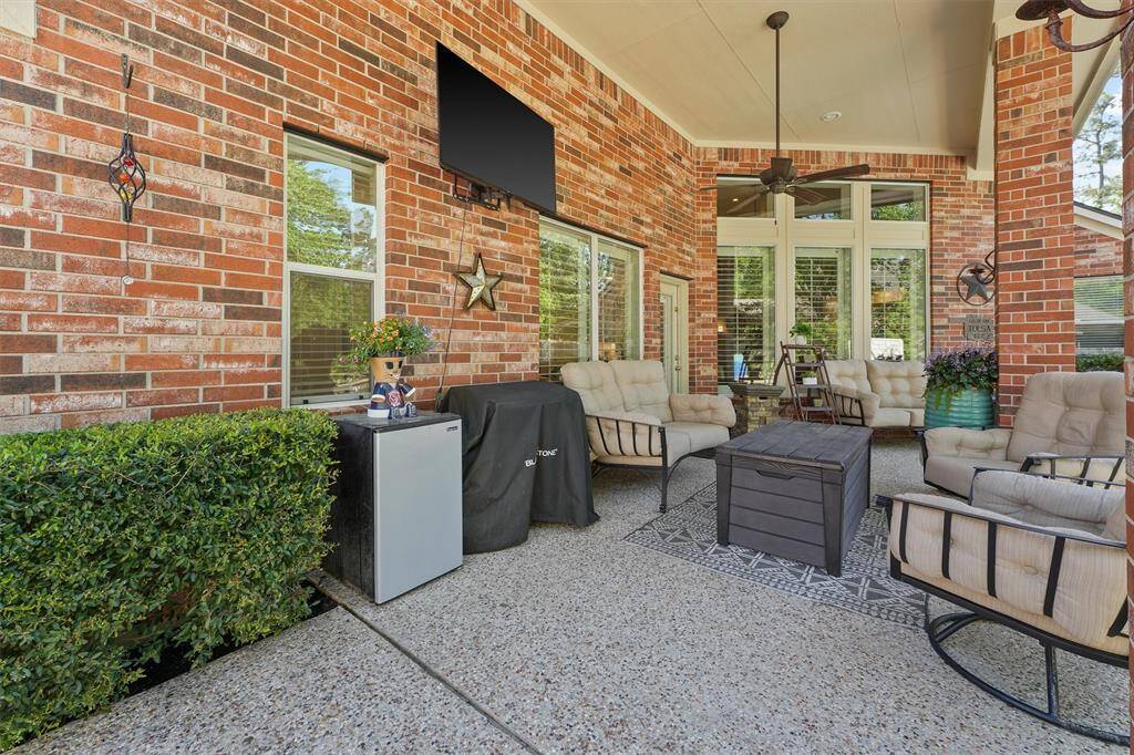 Impressive brick covered patio with ceiling fan to beat the Texas heat. Outdoor lighting is updated to LED lights.