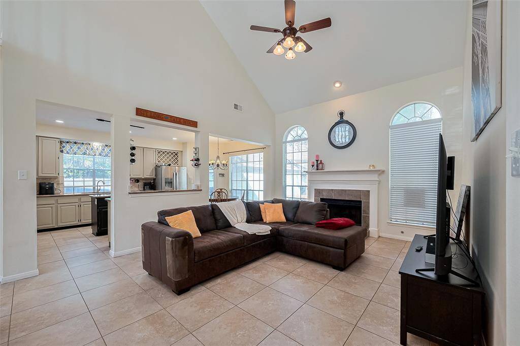 Main living area with vaulted ceiling. Lots of natural light. Gas fireplace.