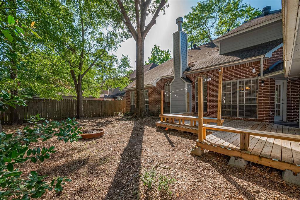 Tree shaded backyard.