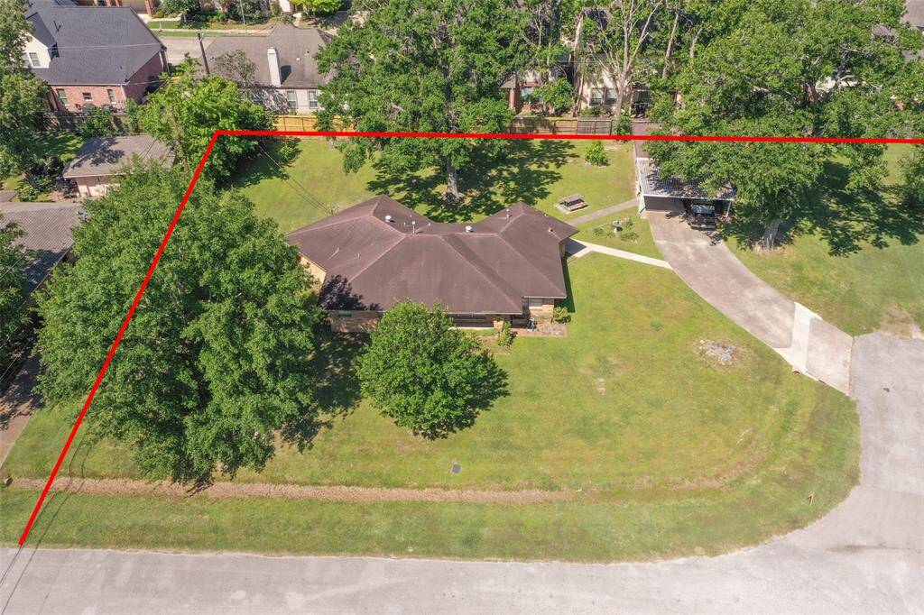 A newer subdivison is located behind the subject property. Red lines show approximate boundaries for subject property.