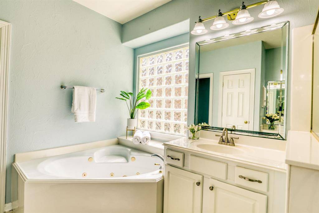 Primary bath includes a deep soaker tub, perfect for relaxing after a long day.