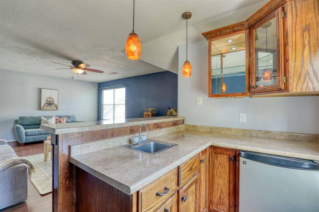 A stylish bar with a sink offers a convenient space for mixing drinks and entertaining guests.