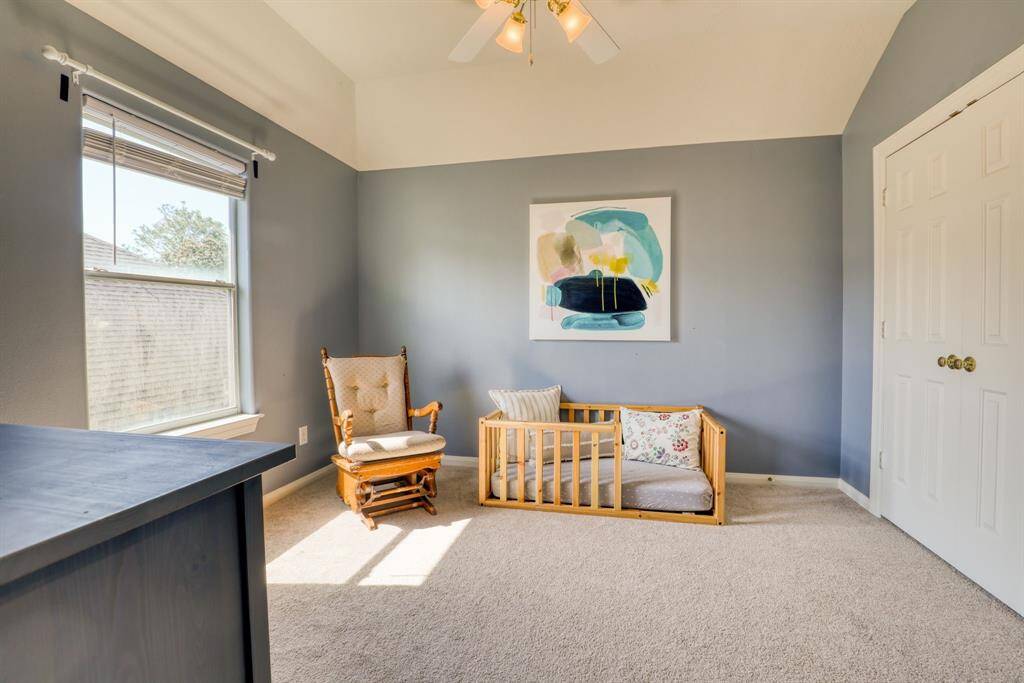 A charming, well-sized bedroom offering a comfortable space, ideal for a personal retreat or flexible use