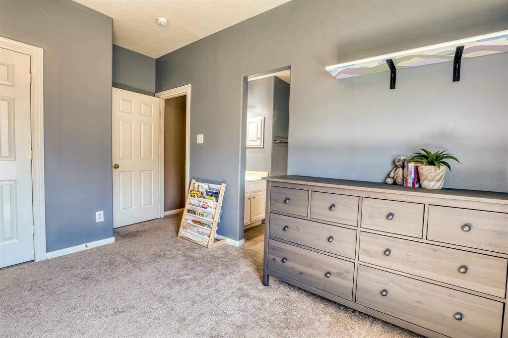 Immaculately maintained bedroom, featuring crisp finishes and a tidy, tranquil ambiance.