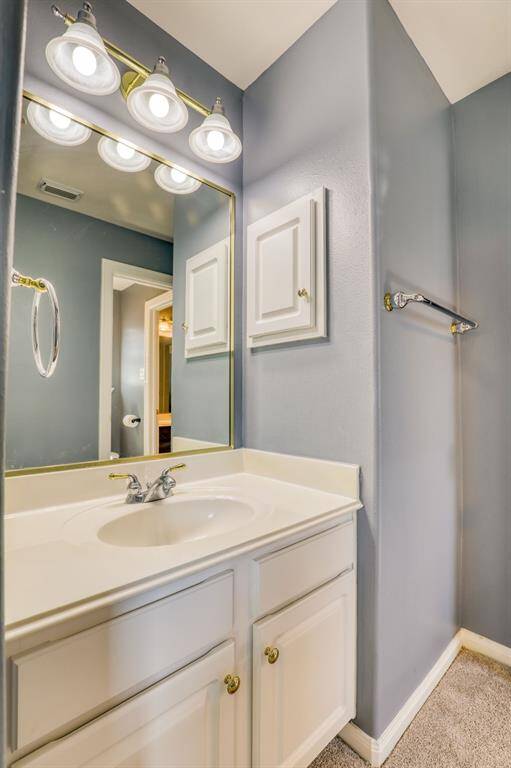 Stylish vanity with ample storage and a sleek design, perfect for daily routines.