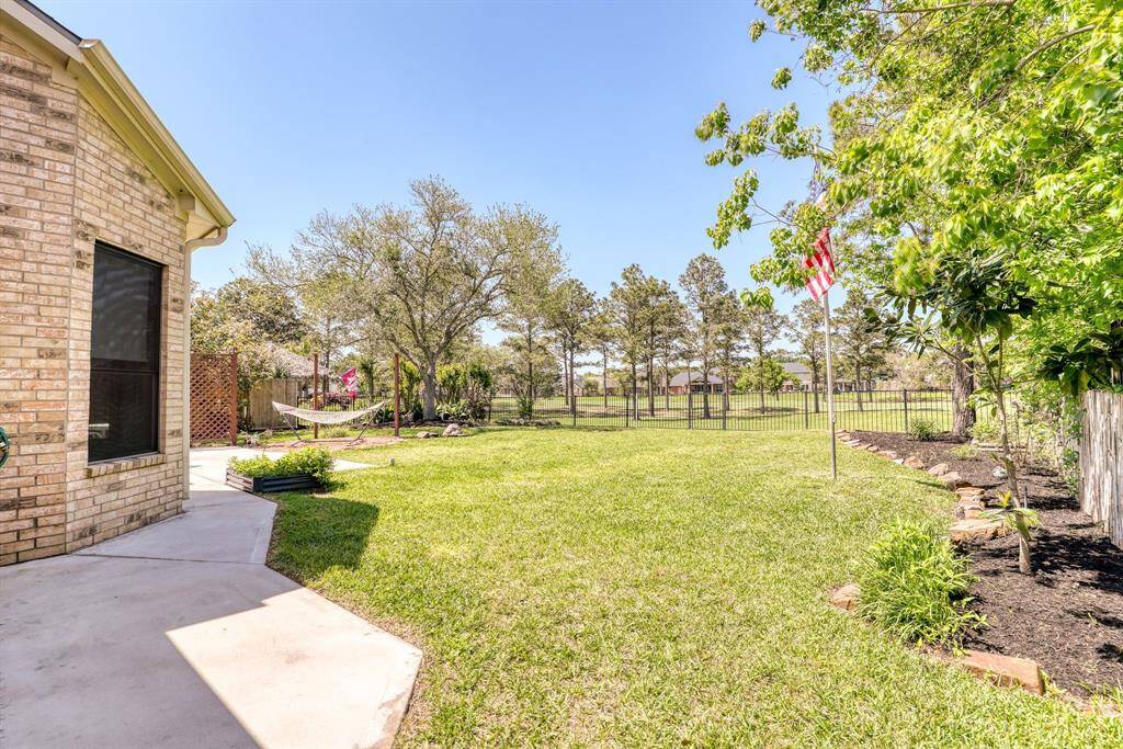 The spacious backyard provides plenty of room for outdoor activities, relaxation, or entertaining, offering endless possibilities for creating your ideal outdoor space