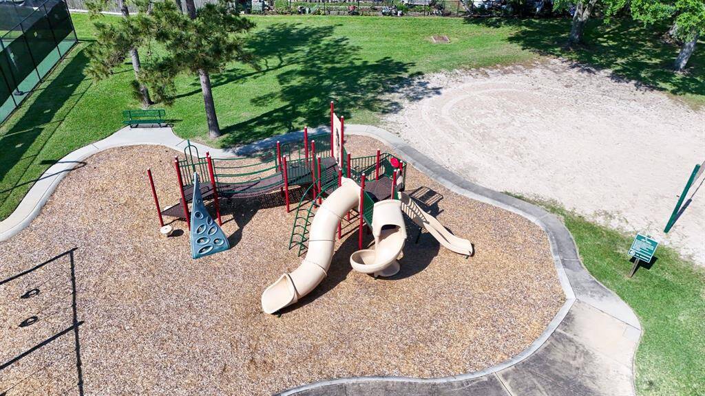 Community playground with well-maintained equipment, providing a great space for outdoor fun and recreation.