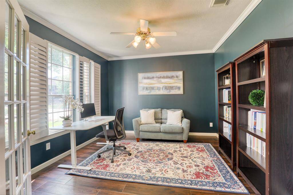 Conveniently located just off the entry, this spacious home office offers a quiet and productive space. Perfect for remote work or creative pursuits, it features natural light and a refined atmosphere that seamlessly blends function and style.