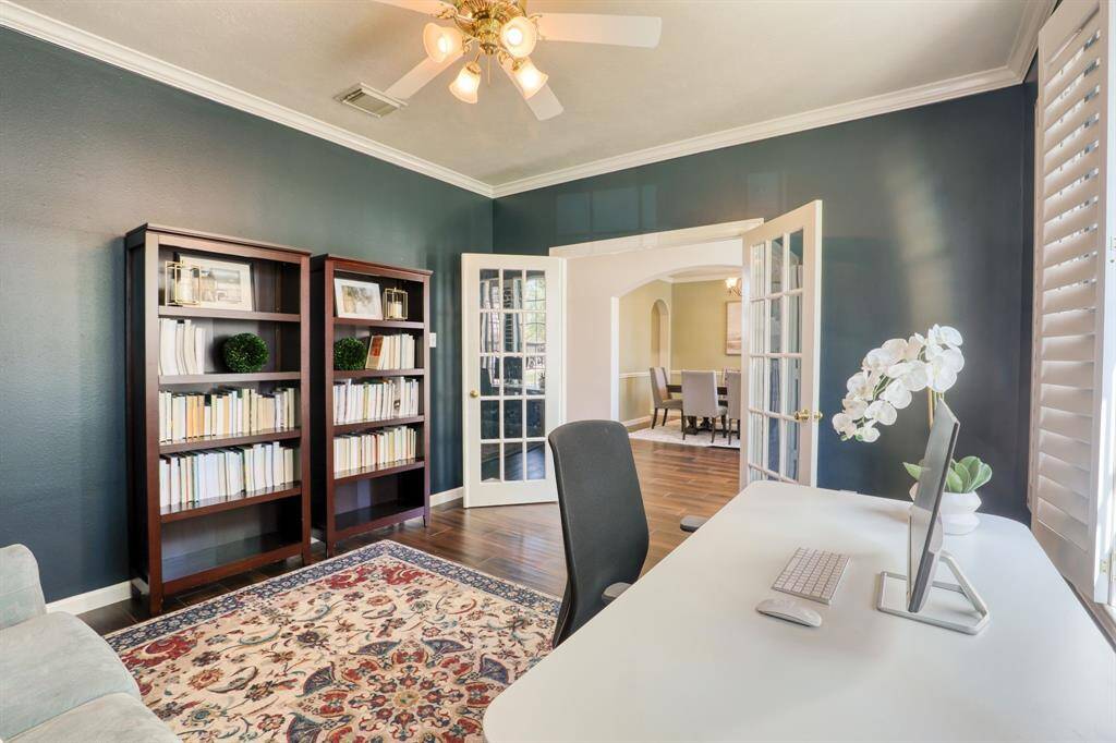 The elegant study, featuring beautiful French doors, offers a quiet and refined space perfect for work or relaxation.
