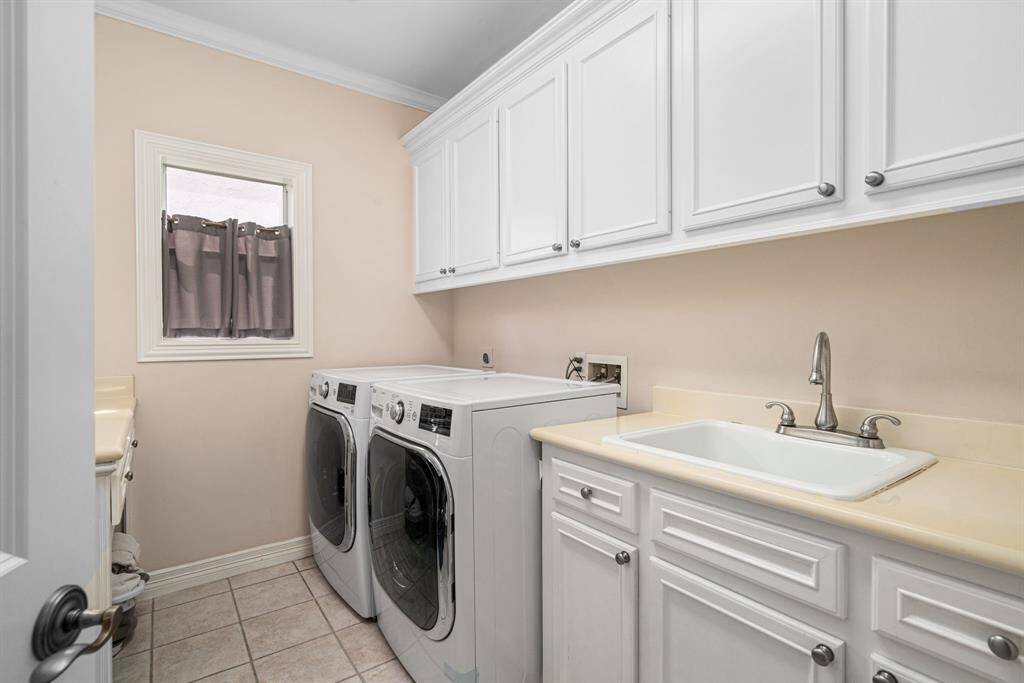 Second floor laundry room with all the bedrooms.