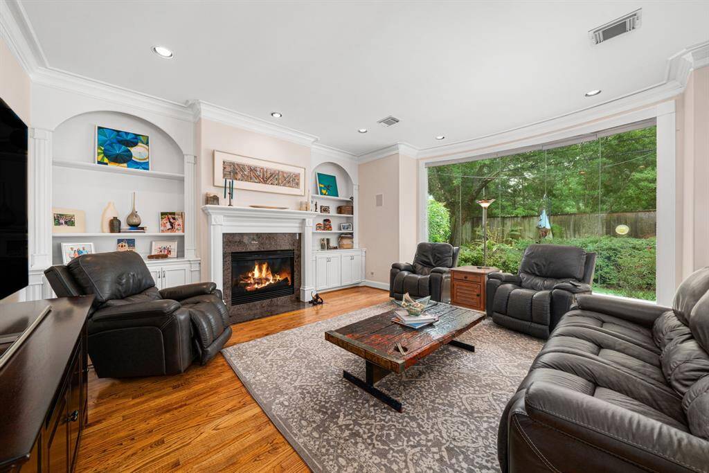 Lovely living room with lots of natural light and beautiful landscaping.