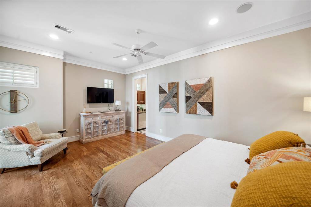 Occupying the entire third floor, the spacious primary suite offers a private retreat with room to spare—providing a peaceful escape from the bustle below.