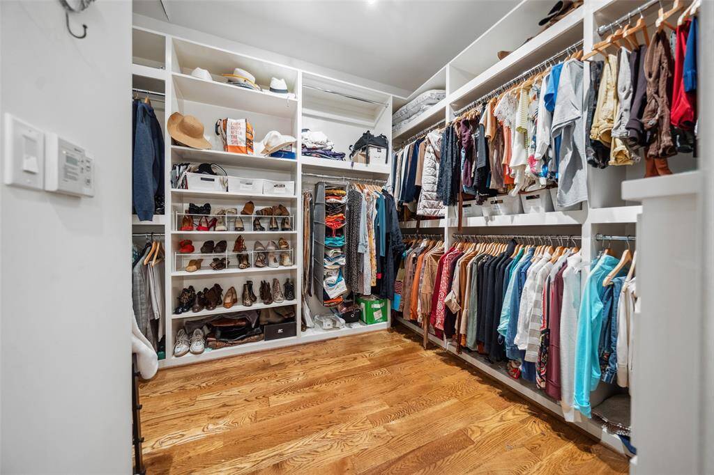 The walk-in closet feels like a boutique, with thoughtfully designed storage, built-ins, and ample space to keep everything beautifully organized.