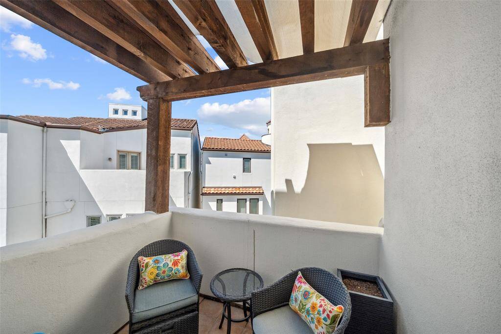 The fourth-floor balcony is topped with a pergola for shade and ambiance, offering elevated views of the Caceres grounds and open skies—your own private perch above it all.